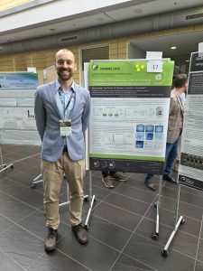 Jakub Grzybek presenting the poster