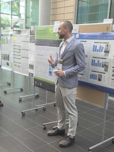 Jakub Grzybek presenting the poster